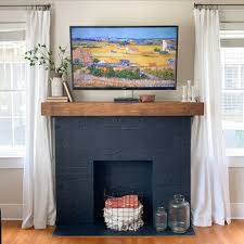 Painting a wooden fireplace mantel is an easy way to change the look of an entire room overnight. Diy Fireplace Mantel A Bold Paint Makeover Shoe Makes New