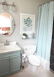 A slender, horizontal sink saves space in a small bathroom. 22 Ideas Small Bathroom Decorating Pictures Small Bathroom Decorating Pictures With Blue Curtain Small Bathroom Decor Small Bathroom Makeover Bathroom Makeover