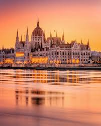 The visitor centre is a very collective venue, where visitors can listen to an educational experience while they wait in comfort surrounded by quality services. The Hungarian Parliament Building In Budapest With A Golden Sunset Glow Cool Places To Visit Budapest Best Places To Travel