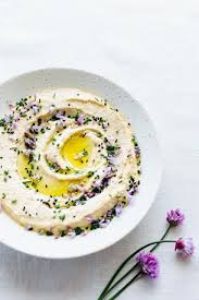 Garbanzo Bean Hummus Chive Blossoms And Toasted Sesame Seeds Beyond Sweet And Savory Recipe Garbanzo Beans Hummus Chive Blossom Garbanzo Beans