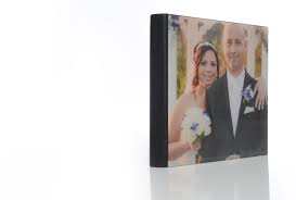 Capture all of the lovely memories created at you wedding day with this gorgeous wooden wedding photo album with green wreath. Wedding Album Crystal Cover