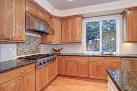 Instantly improve your kitchen space with fresh and chic cabinet ideas. Luxury Kitchen With Kitchen Island Light Wood Cabinets Fitted Stock Photo Picture And Royalty Free Image Image 96729579