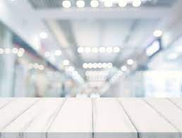 close up of white table top in front of illuminated bokeh blur background paid affiliate paid table wh blurred background white table top background