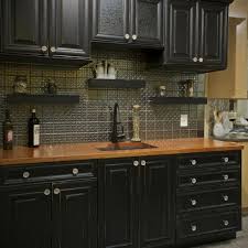 The black is contrasted further with white countertops. Pin By Linnette Jane On House Wood Countertops Kitchen Black Kitchen Cabinets Kitchen Design
