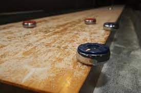 You can score by either knocking the opponent's puck off the shuffleboard table, or by sliding your puck into a score zone of higher value. Care And Maintenance Of Your Shuffleboard