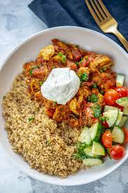 Add the dressing and toss to combine a few more times. Meal Prep Moroccan Chicken Bowls Garnished Plate