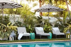 Black And White Striped Pool Umbrella Black And White Stripes Around The Pool Landscaping Around Pool Outdoor Pool Area Pool Decor