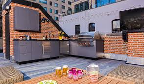 A large, stacked stone fireplace with mounted tv and plenty of covered seating complete the design. 8 Outdoor Kitchen Designs Ideas Plans Danver Outdoor Kitchen Design Outdoor Kitchen Design Layout Outdoor Kitchen