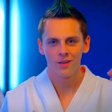 Hawk from Cobra Kai Dazzles with Green Hair