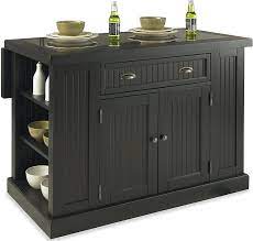 A contrasting kitchen island allows you to introduce new color and texture to the room in an see how to make your island stand out as your kitchen's focal point with a distinctive paint color or wood. Amazon Com Nantucket Distressed Black Kitchen Island By Home Styles Kitchen Islands Carts