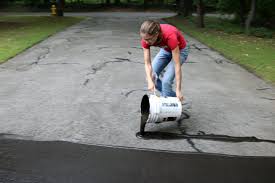 Patches that are higher it's texture is different that the surrounding asphalt. How To Fix Cracks In A Driveway And Apply A Coat Of Sealant How Tos Diy