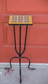 An arts & crafts green tile top plant stand, side or hall table. 3 Legged Vintage Iron Plant Stand Revived With Talavera Tile Top Iron Plant Stand Vintage Iron Talavera Tiles
