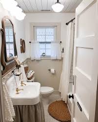 The bathroom itself is dominantly painted in brown and white, such as the beadboard, upper wall, floor, sink, and vanity. The 70 Best Farmhouse Bathroom Ideas Home And Design