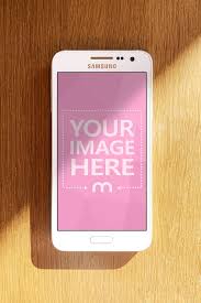 Just upload an image and your mockup is ready in a few clicks! White Android Phone On Desk With Shadow Over Screen Mockup Generator Mediamodifier