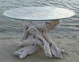 The table's rich stain hue highlights the wood's natural grain, creating a subtle sunburst effect. 900 Driftwood Tables Ideas Driftwood Driftwood Table Driftwood Furniture