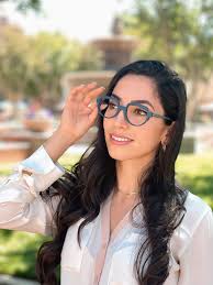 Mariam is wearing a selection of frames by Struktur Eyewear -