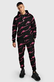 Order online now for next day delivery and easy free returns. Pink All Over Man Print Hooded Tracksuit Boohoo