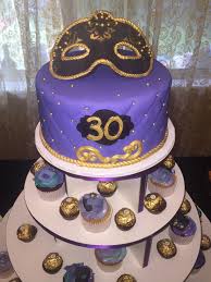 50th Birthday Cupcakes Black And Gold Masquerade Cake And Cupcakes For A 30th Birthday Party In Black Gold And Purple Colors Masquerade Cakes 30th Birthday Parties Cupcake Cakes