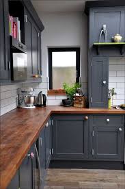 Kitchen cabinets new this week: Butcher Block Countertops Paired With Dark Blue Painted Cabinets American Kitchen Design Kitchen Design Kitchen Cabinets Makeover