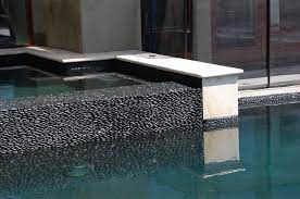 Maybe you would like to learn more about one of these? Gray Black Standing Pebble Tile Pool Wall Modern Pool Hawaii By Design For Less Houzz