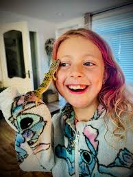 This amazing young lady has dreamed of having her own reptile. To say she's  obsessed would be an understatement. She came in this evening to meet some  of the reptiles and hold