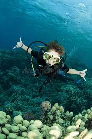 boy scuba diver scuba diver swims over reef sponsored paid paid scuba reef swims boy scuba scuba diver diver