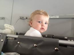 Best Airplane Seats Choosing The Best Airline Seats When Flying With Kids Baby Bassinet Flying With Kids Flying With A Baby