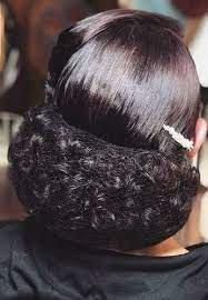 Her Fresh Curls Are Safely Protected Under The Invisible Hairnet Balayage Hair Big Bun Hair Light Hair