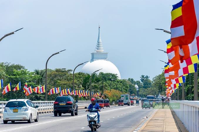 Kalutara Bodhiya stupa hollow walk-inside paintings Buddha Kalu River highway bridge Sri Lanka south coast