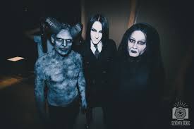 Across from it, sitting hunched against the red concrete wall, is an old man. 52 Motionless In White Wallpaper Hd