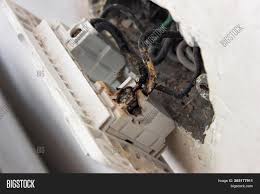 The wall outlet is burned out after using a 120v heater. Switch Burn Melted Image Photo Free Trial Bigstock