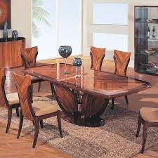 You can combine all the functionality of a large rectangular table with the soft aesthetics of a circular version, by choosing something like this amazing example! 22 Awesome Dining Table Designs