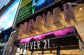 A store full of garments neatly folded and hung. Forever 21 At Times Square Gemini Tolentino Flickr