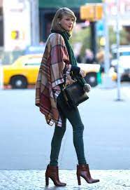 Taylor swift in pink and purple pictures. Taylor Swift In Tight Jeans And Poncho 02 Gotceleb