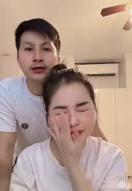 Mai Thoj and Cai are now officially divorced. As part of the separation,  Mai gave her ex-husband, Cai, 100 million (it's unclear if this is in kips  or dongs), equivalent to about