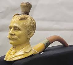 The picture shows factory workers assembling corn cob pipes in the 1940s.  Corn cob pipes got their start thanks to Missouri Meerschaum Company.**.**  Founder Henry Tibbe, a Dutch immigrant and woodworker, began