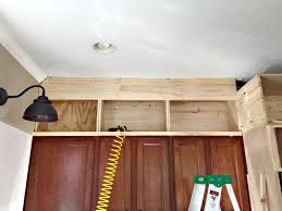 In case you have been living in a cave for the past five years, tall cabinets are all the rage. Building Cabinets Up To The Ceiling From Thrifty Decor Chick