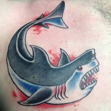 Brown men love shark tattoo on their lower arm; 9 Popular Shark Tattoo Designs And Meaning I Fashion Styles