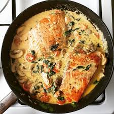 Tuscan Butter Salmon Buttery Cream Sauce With Mushrooms Spinach And Cherry Tomatoes Butter Salmon Healthy Recipes Stuffed Mushrooms