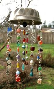 Whimsical Windchime Made From Old Bundt Pan Beads Dice Dominoes Anything Sparkly Diy Art Projects Diy Wind Chimes Wind Chimes