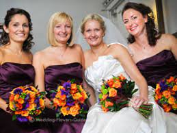 Purple calla lily and orange rose bridal bouquet. Real Weddings Lindsay S Purple And Orange Wedding Flowers