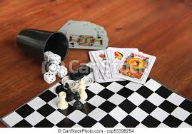 Classic games like chess and sudoku are now easier to play on iphones and ipads. Mix Of Goblet Table Games Dice Spanish Poker Cards Chess And Checkers Canstock