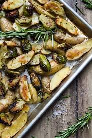 Roasted Fingerling Potatoes And Brussels Sprouts With Rosemary And Garlic Recipe Vegan Holiday Recipes Recipes Veggie Dishes