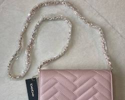 Image of blush pink quilted leather crossbody bag