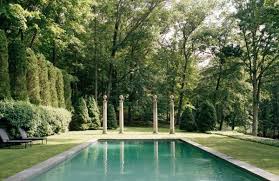 an expansive pool is set into the bucolic setting of stephen sills bedford property punctuated by classical colum con imagenes piscinas modernas piscinas casas con piscina pinterest