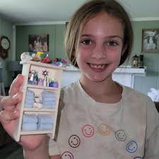 Up next... bathroom. Still in the rough Tub and toilet are model magic. The  sink cabinet is cardboard covered with scrapbook paper, stir sticks, old  jewelry bits and the sink is a
