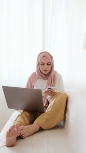 Woman in Pink Hijab Sitting on White Sofa While Having a Phone Call Free  Stock Video Footage, Royalty-Free 4K & HD Video Clip