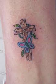 So if you are looking for your first tattoo then a butterfly tattoo is the best idea for you. Cool Cross Tattoos Butterfly Tattoo Design Butterfly Cross Tattoos Butterfly Tattoos Crayon
