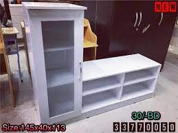 for sale wood tv table size 145x40x113 white color modern style new made in malaysia price 30 bd للبيع طاولة تلفزيون خشب لون ابيض جديد صنع في م