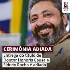Adiada a entrega do título de Doutor Honoris Causa ao escritor Sidney Rocha 